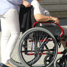 Elderly getting pushed around in a wheel chair